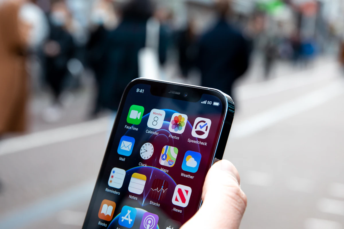 A person holding an iphone in their hand