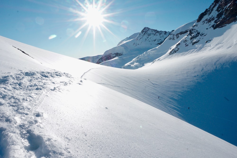 snow covered mountain under blue sky during daytime