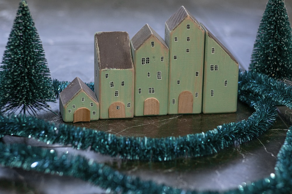 brown wooden house on blue and white textile