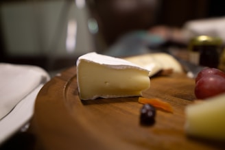 sliced cheese on brown wooden chopping board
