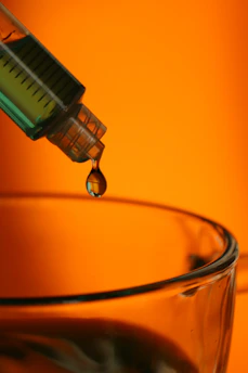 water drop in clear glass mug