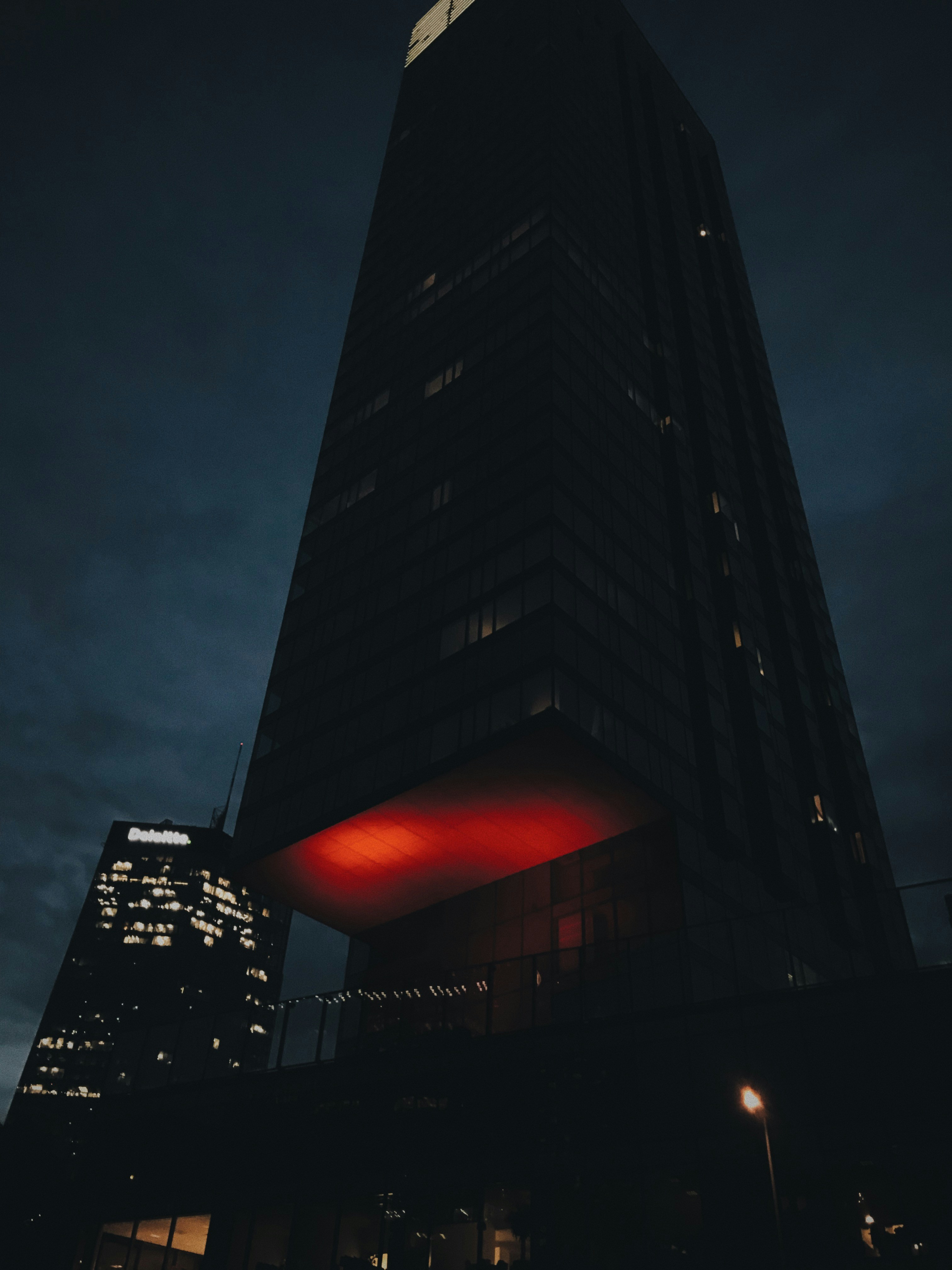 Black high rise building during night time photo – Free Польша Image on ...