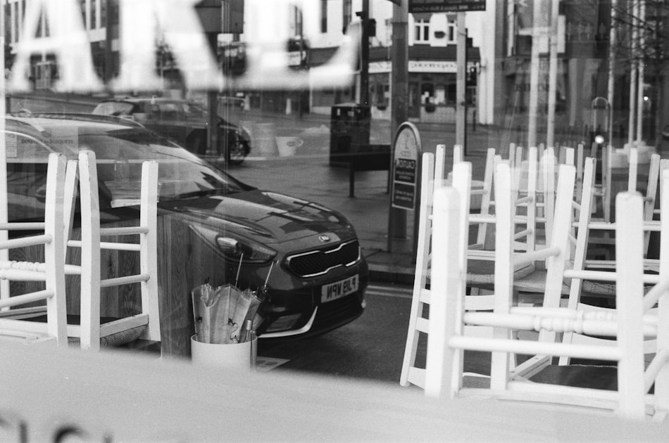 grayscale photo of car on road