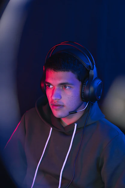 man in blue hoodie wearing black headphones