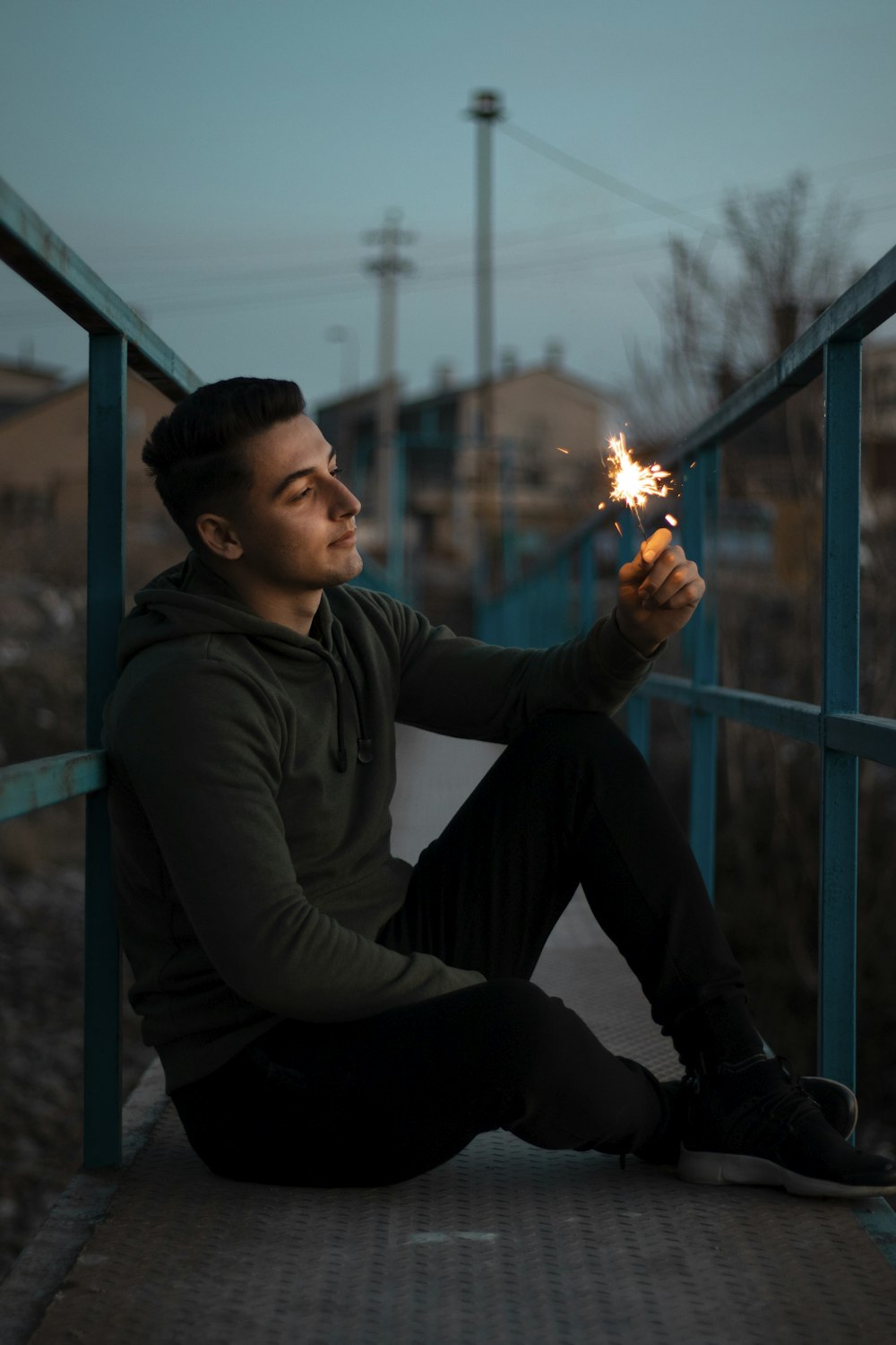 man in black long sleeve shirt holding fire