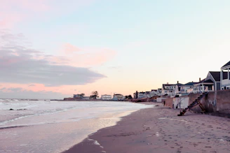 Scenic view of a peaceful beach at sunset, inviting relaxation.