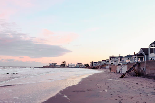 Scenic view of a peaceful beach at sunset, inviting exploration and calm.