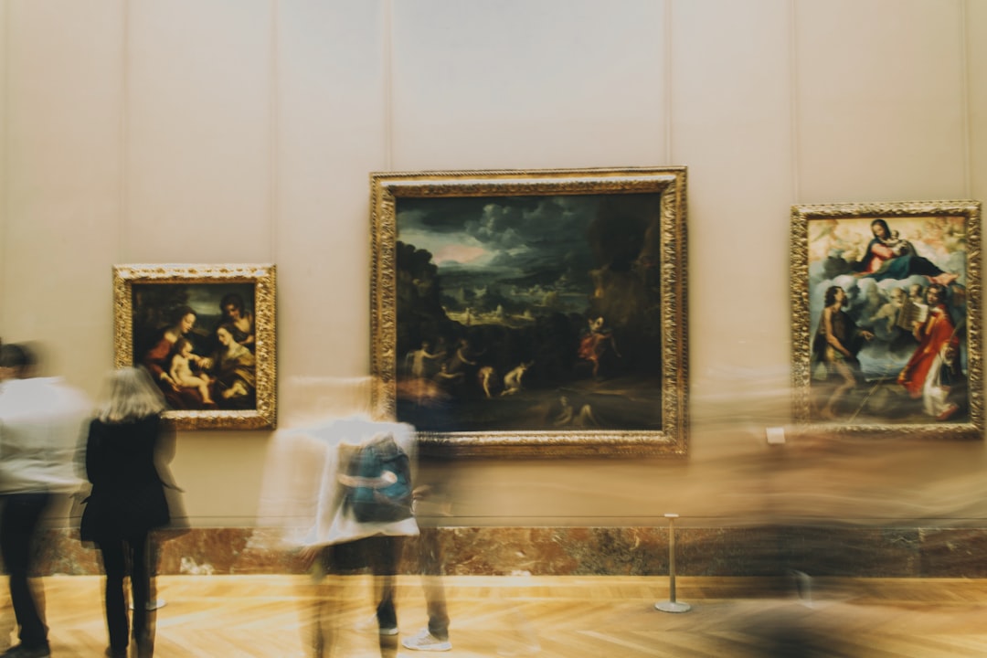 woman in white dress standing near painting, Musee du Louvre