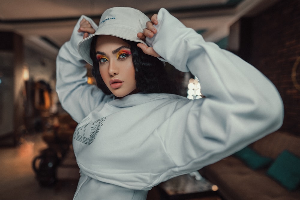 woman in white hijab and white long sleeve shirt