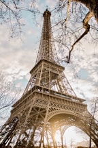 eiffel tower under white clouds during daytime