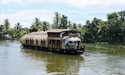 brown wooden boat on body of water during daytime