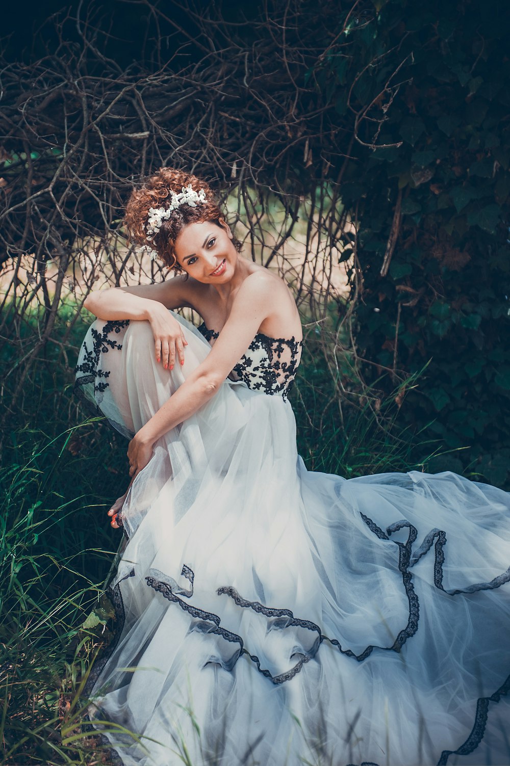 woman in white dress lying on green grass