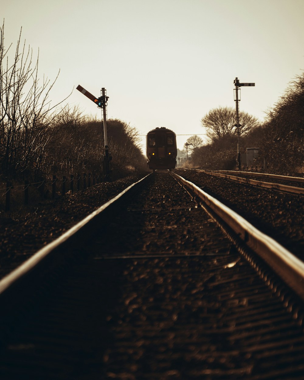 train rail in grayscale photography