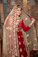 A smiling bride wearing a noorzar statement necklace and earrings set on her wedding day.