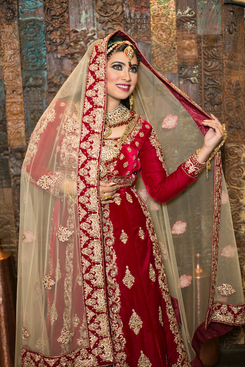 woman in red and white floral sari