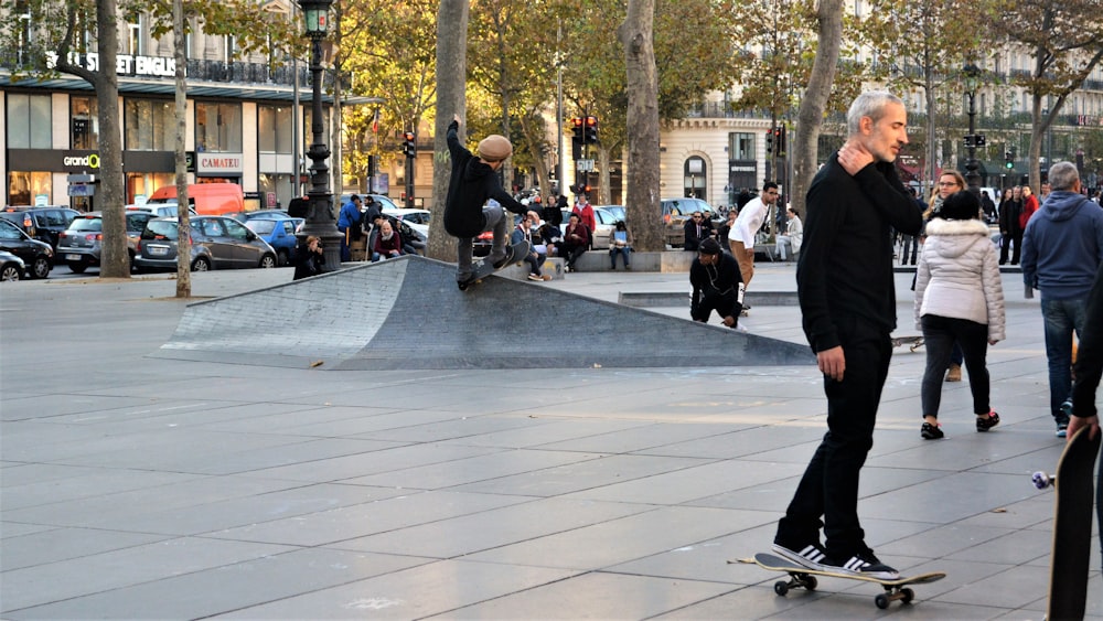 people walking on sidewalk during daytime