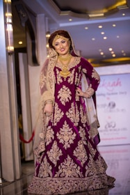 woman in purple and gold floral sari