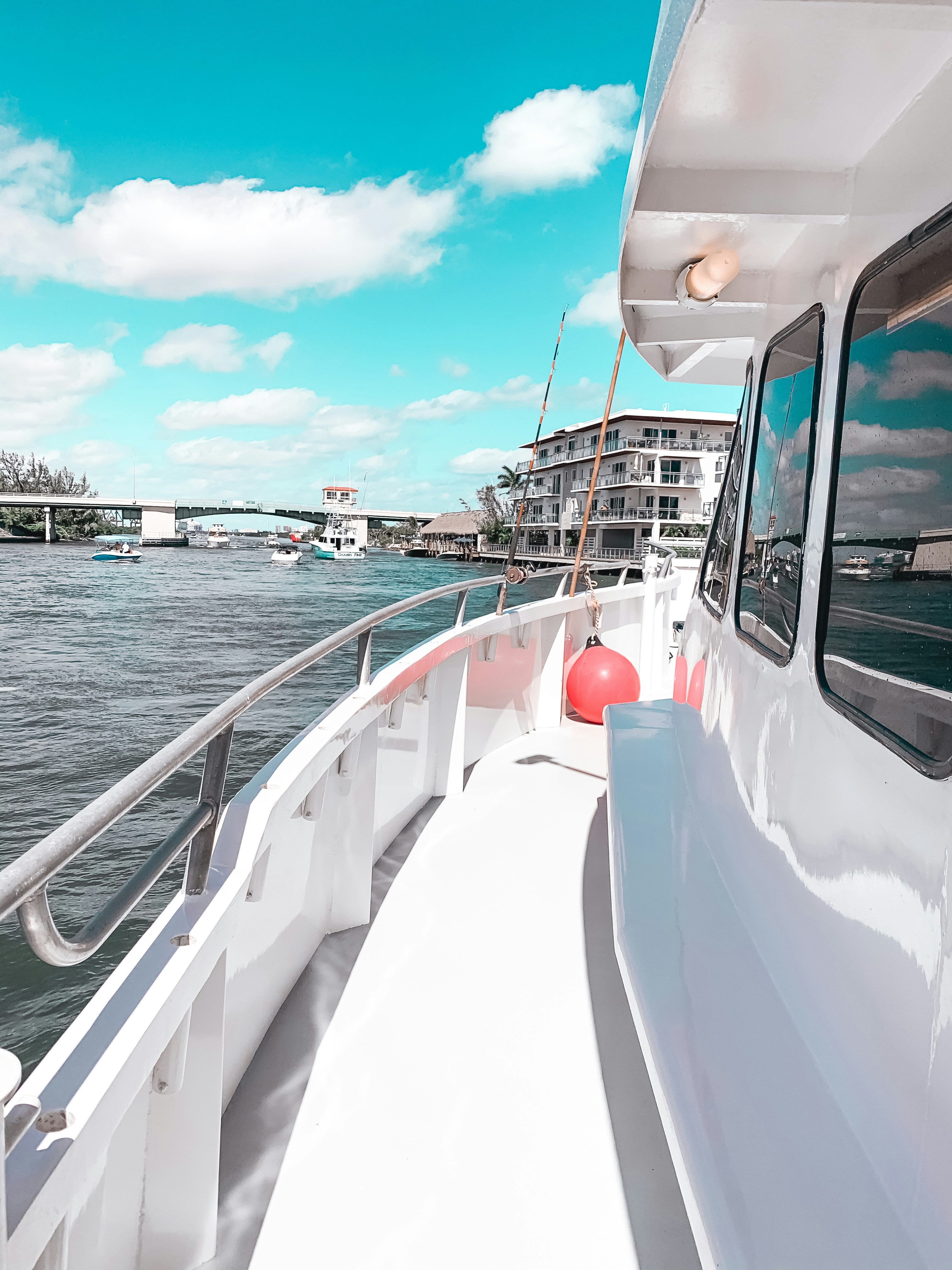 white boat on sea under blue sky during daytime