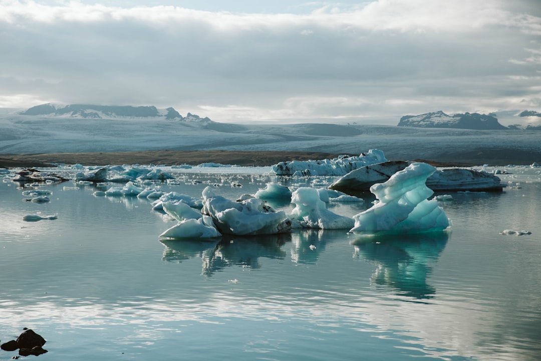 ice on water under cloudy sky during daytime