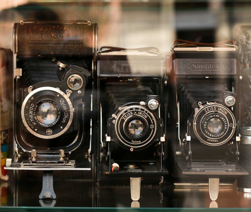 black and silver camera on glass table