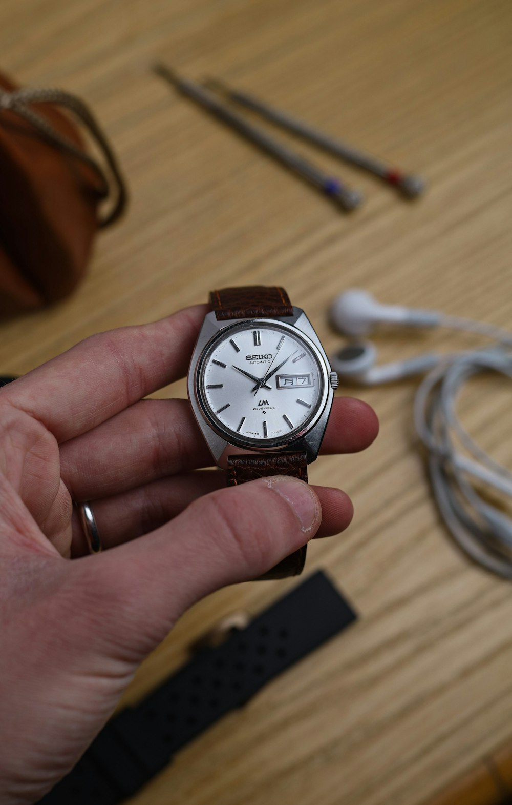 silver and white analog watch