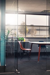 Desk area in a business hotel room with natural light.