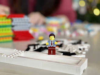 lego mini figure on white computer keyboard