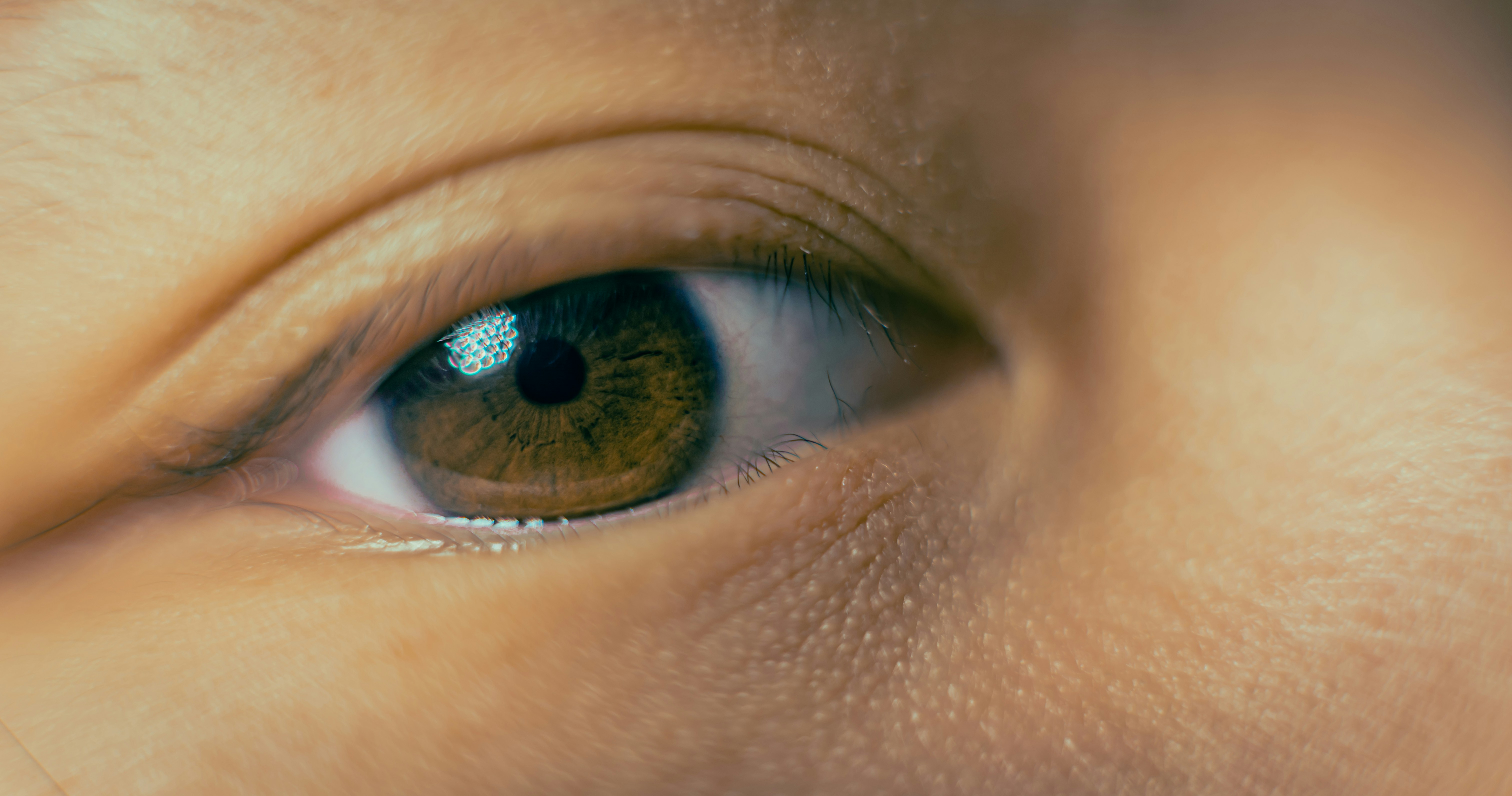 persons blue eyes in close up photography