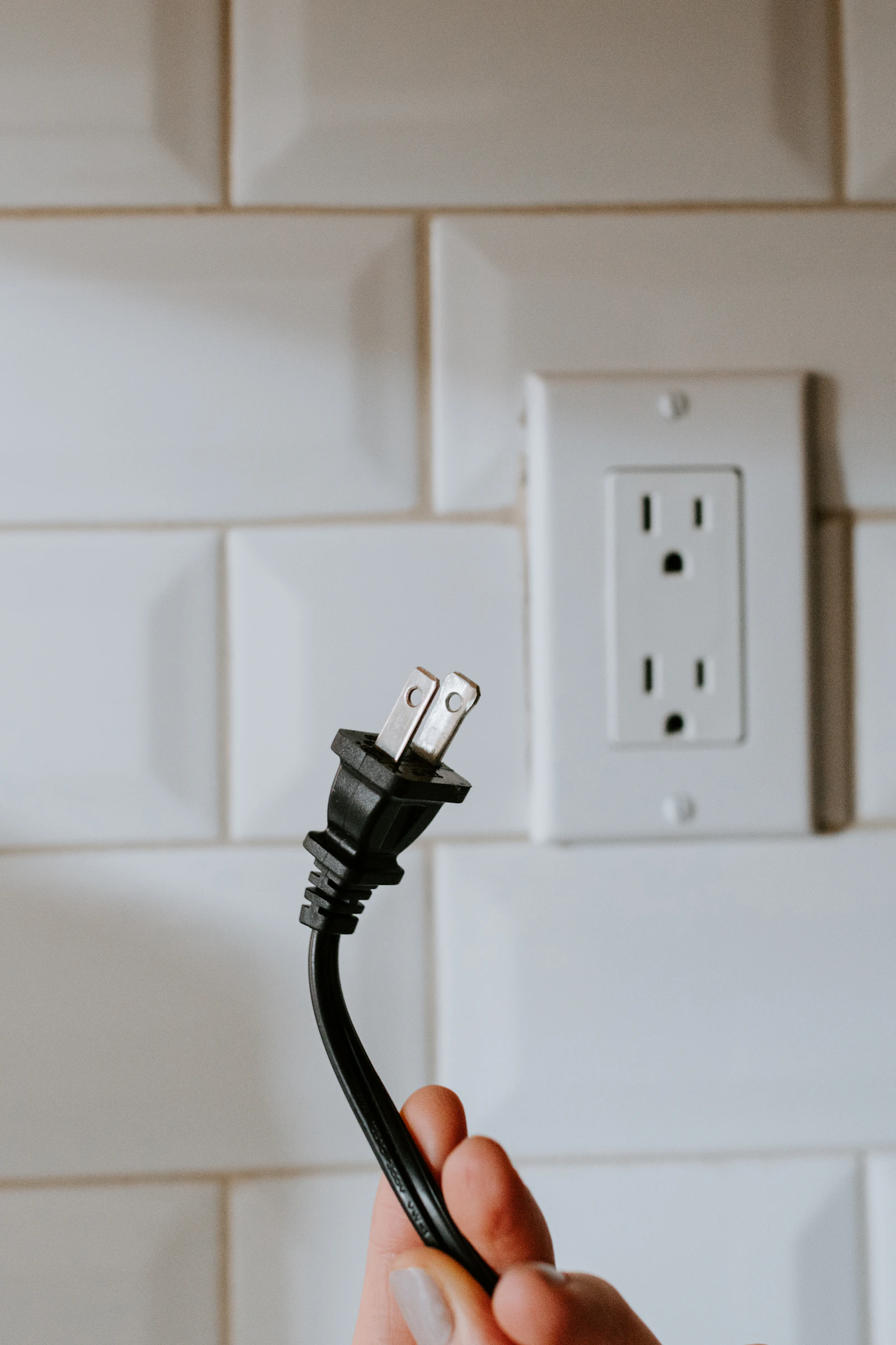 USB cable plugged into a wall socket