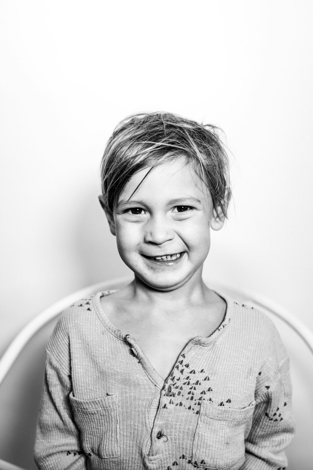 grayscale photo of smiling girl