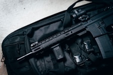 black rifle on black bag