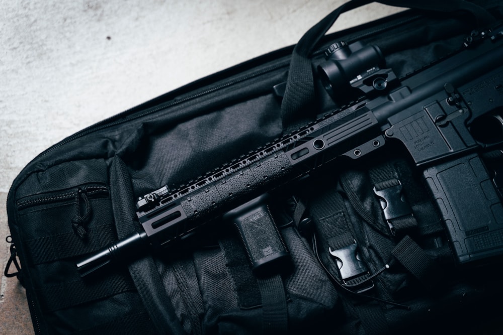 black rifle on black bag