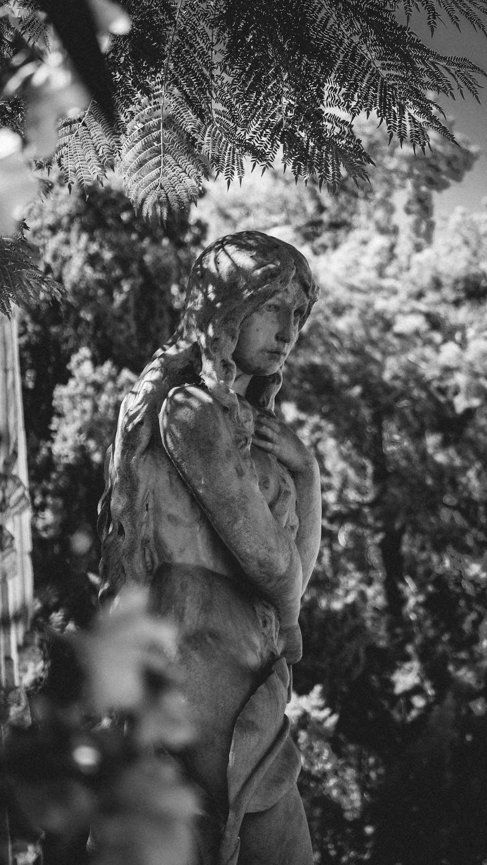 grayscale photo of man statue