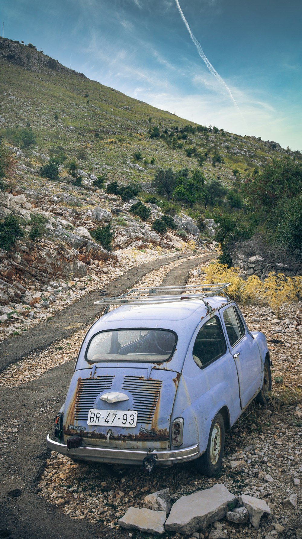 blue volkswagen t-2 on dirt road during daytime