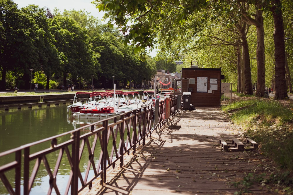 people walking on bridge over river during daytime