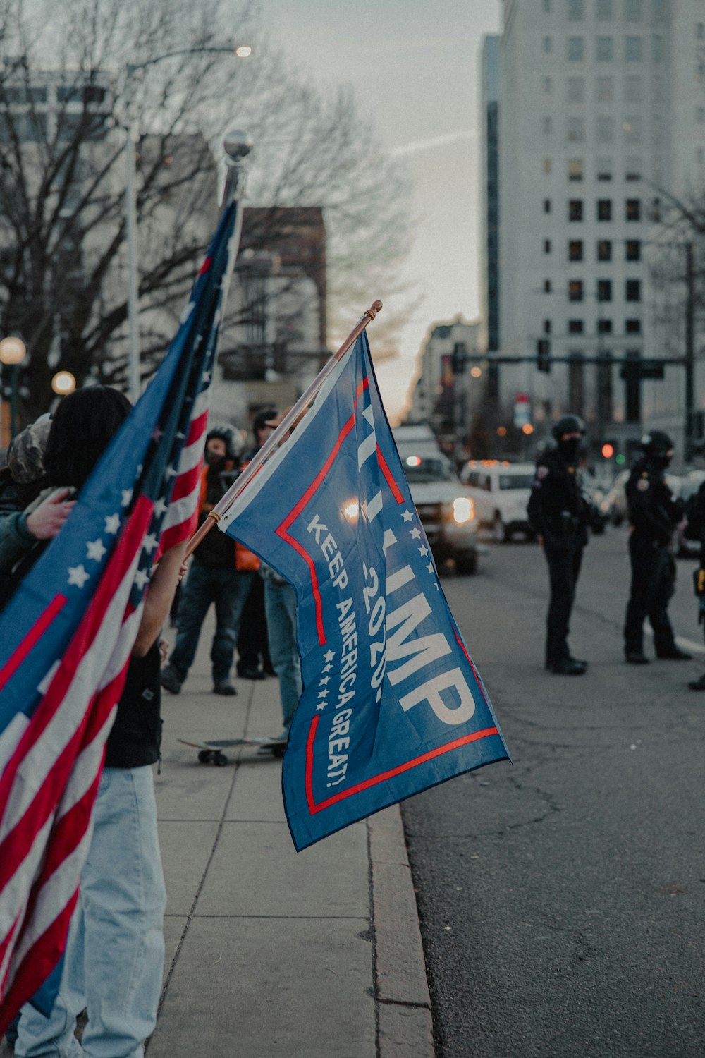 people walking on street with flags during daytime