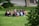 A group of diverse citizens discussing ideas in a park.