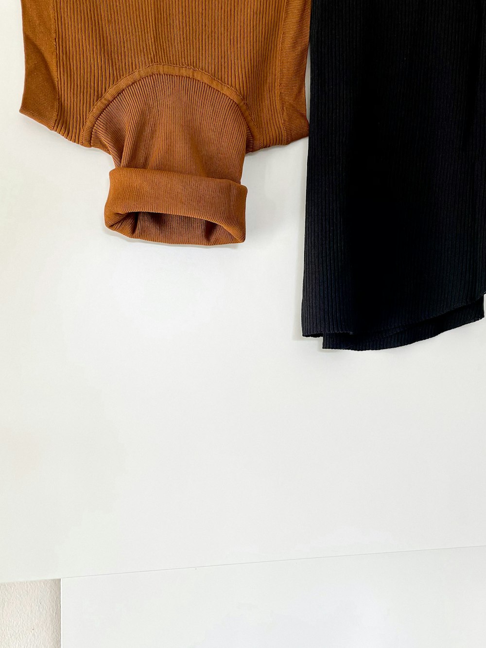 black and brown textile on white table