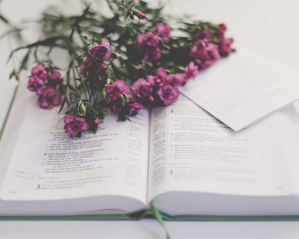 a book with a bunch of flowers on top of it