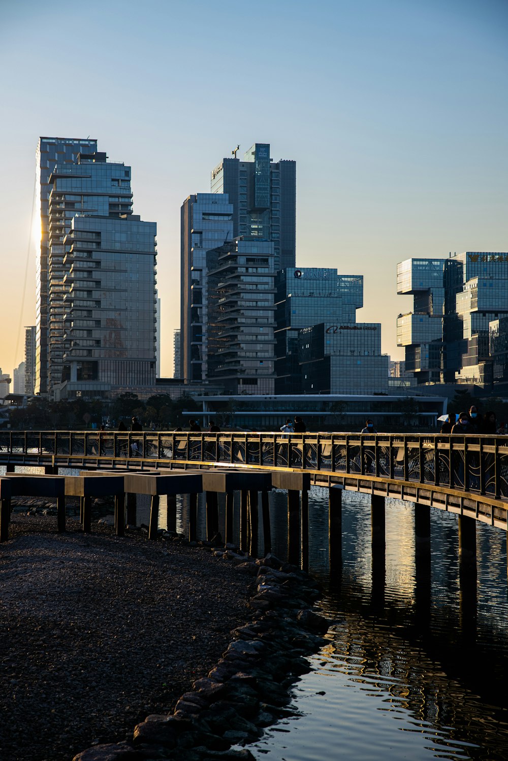 gray concrete bridge over body of water during daytime