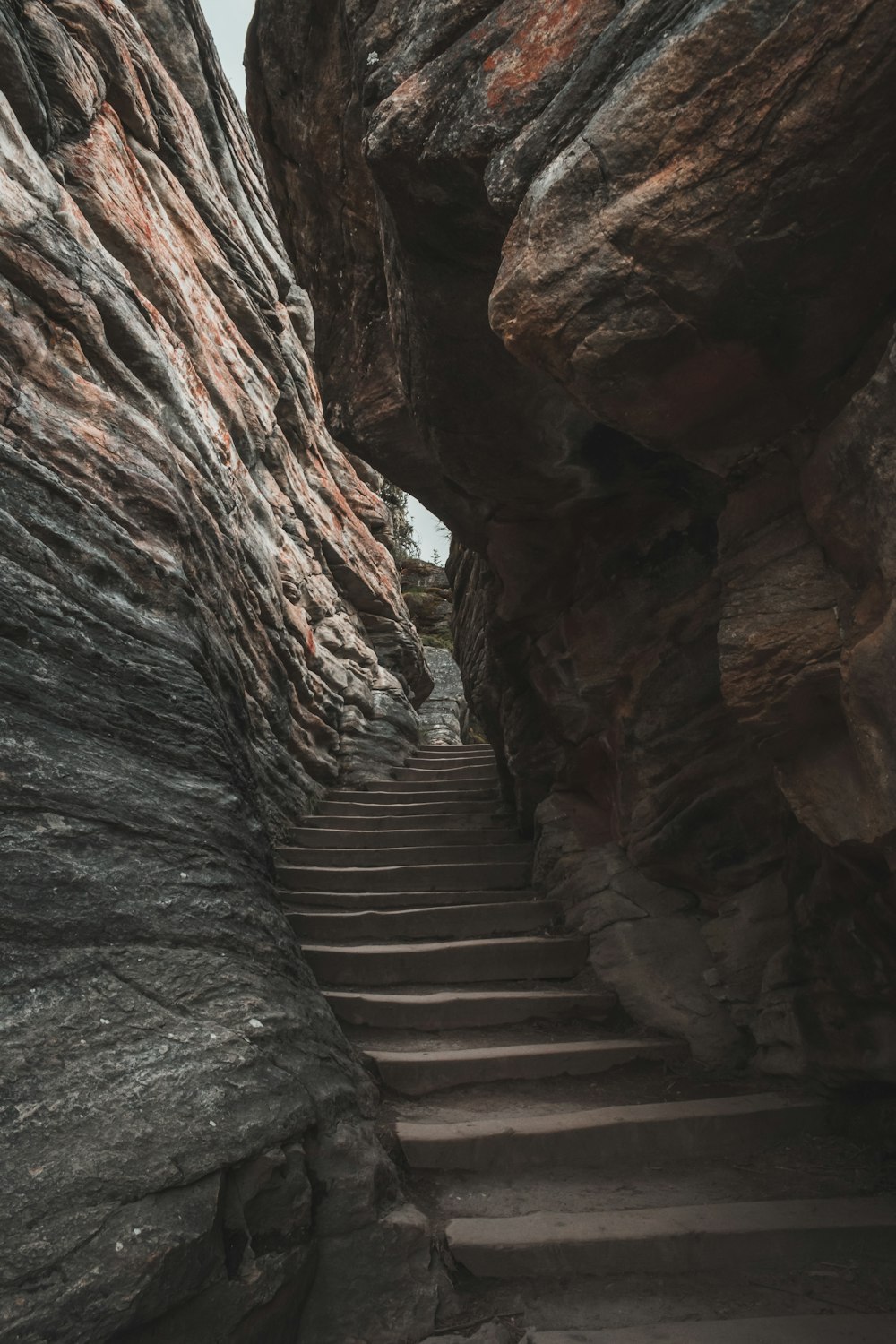 a stone staircase leading up to a cliff