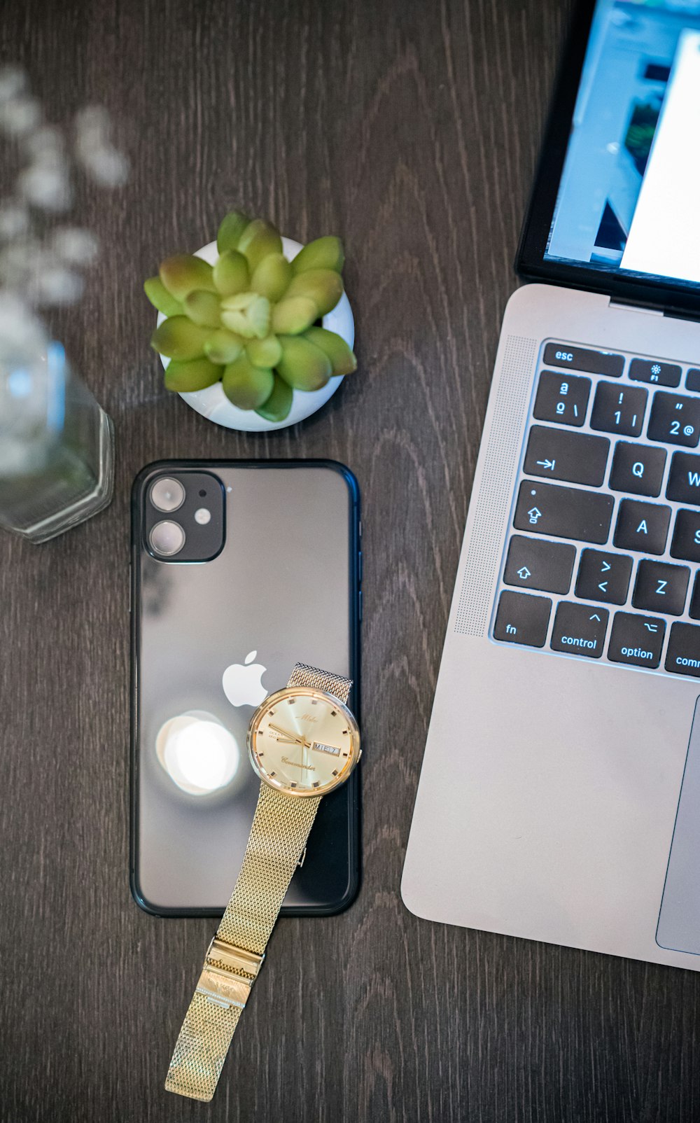 silver iphone 6 beside macbook pro