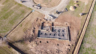 A wide shot of a completed concrete foundation with clean lines and solid structure.