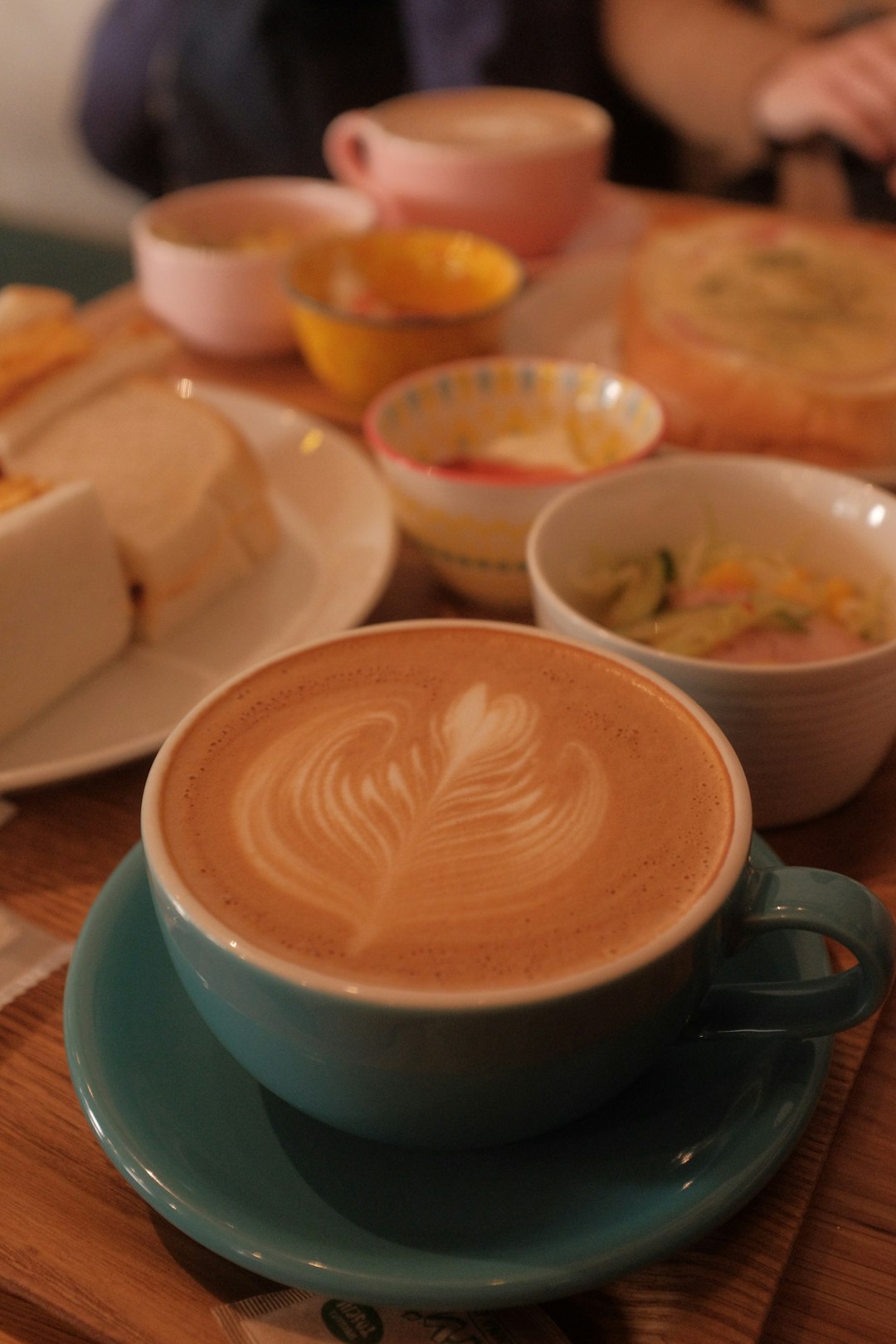 white ceramic cup with cappuccino