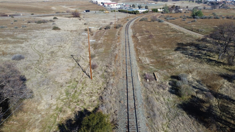 white and brown train on rail tracks