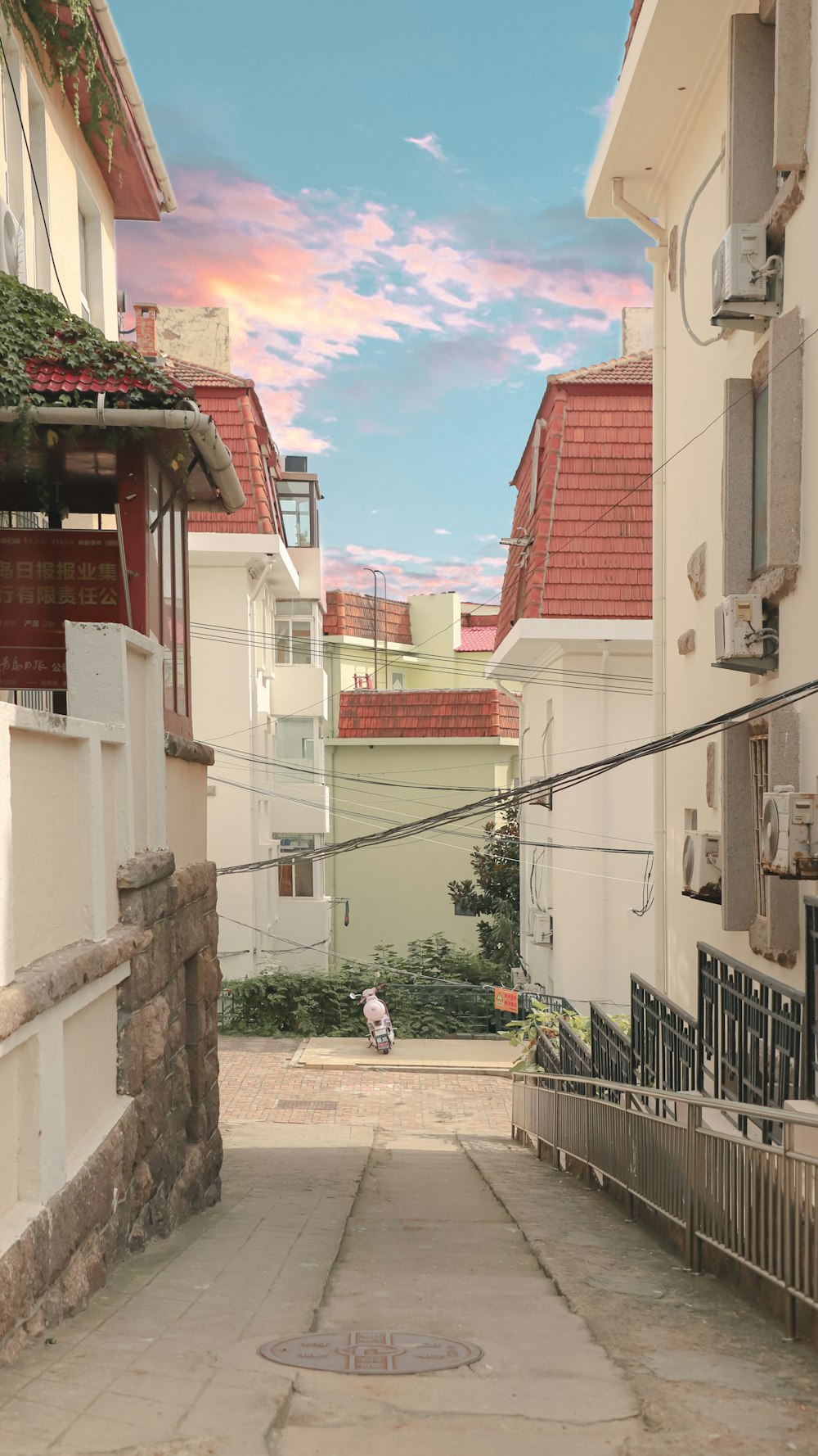 person in white shirt walking on street during daytime