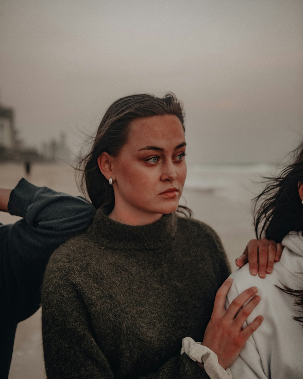 woman in gray turtleneck sweater