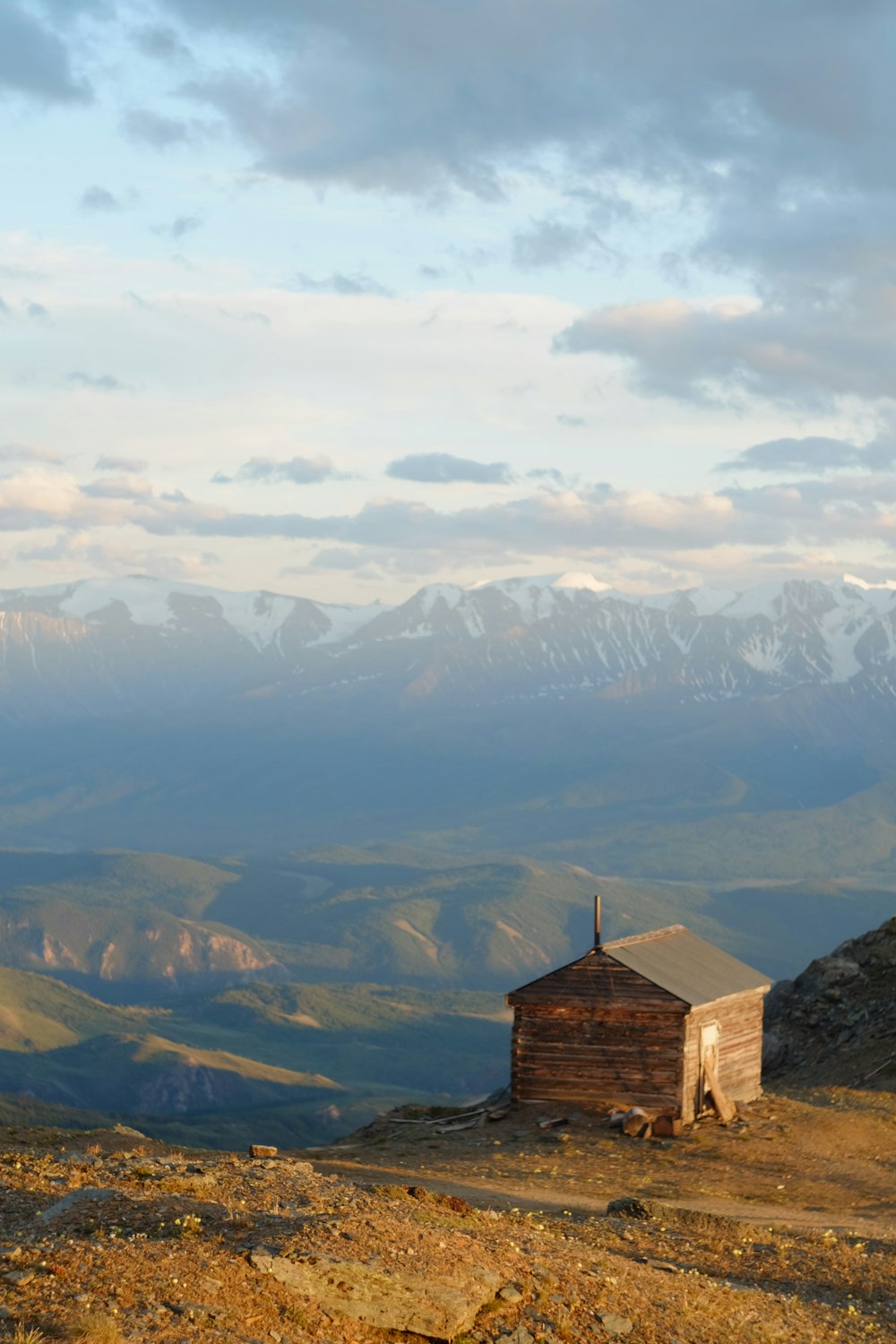 brown concrete building on top of mountain during daytime