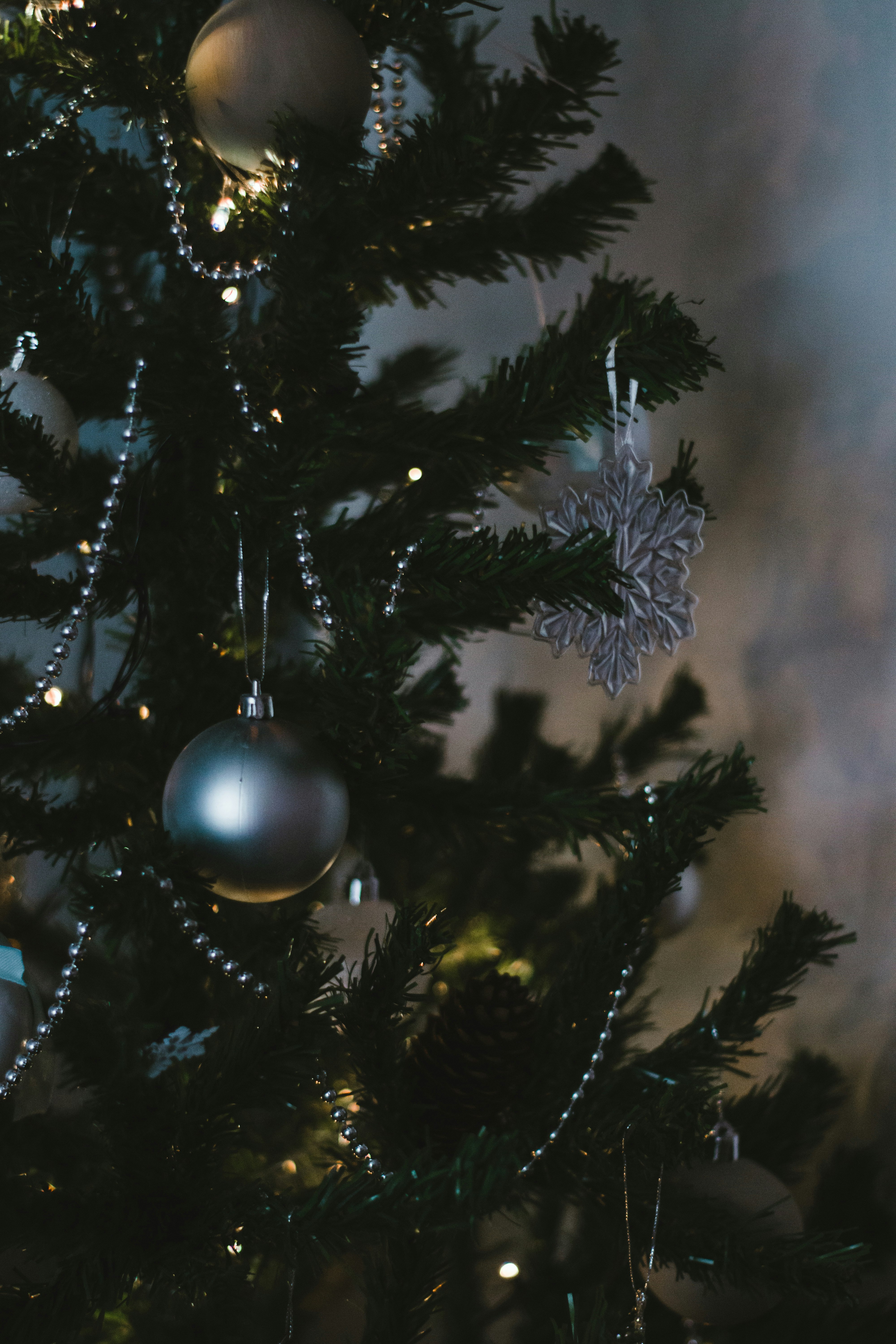 silver bauble on christmas tree