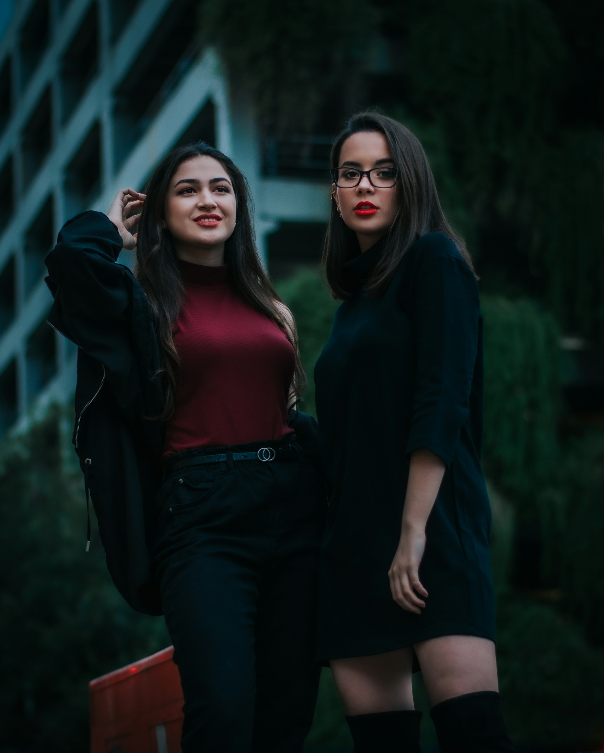 woman in black long sleeve shirt and black skirt